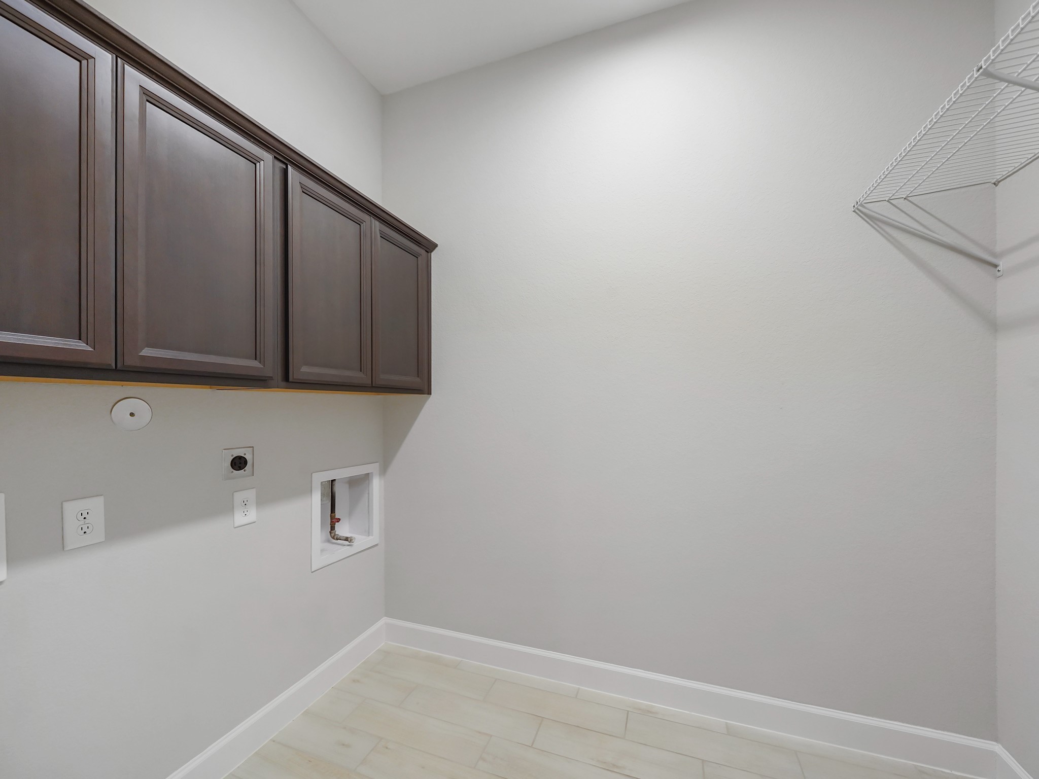 6919 Myrtle Drive Katy, TX 77493 - Photo 34 of 38 a view of storage and utility room with wooden floor