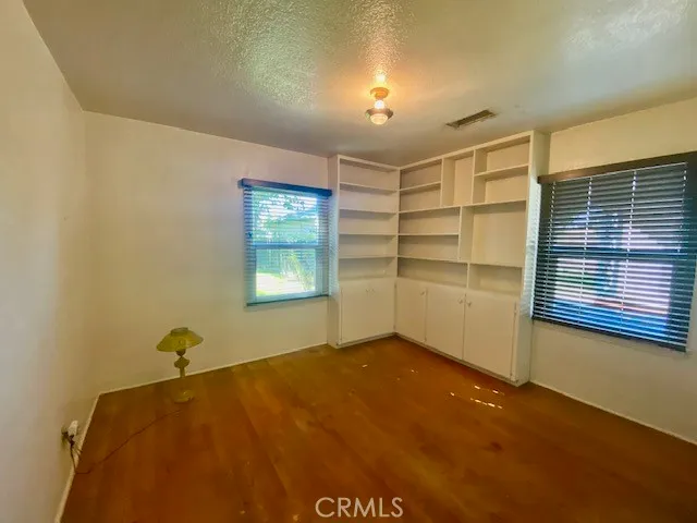 a view of a room with gym equipment and a window