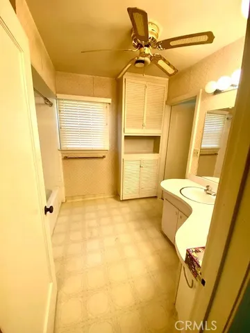 a bathroom with a sink and a shower
