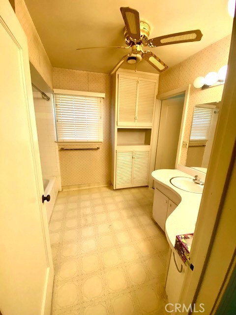 8 West 25th Street Merced, CA 95340 - Photo 10 of 14 a bathroom with a sink and a shower