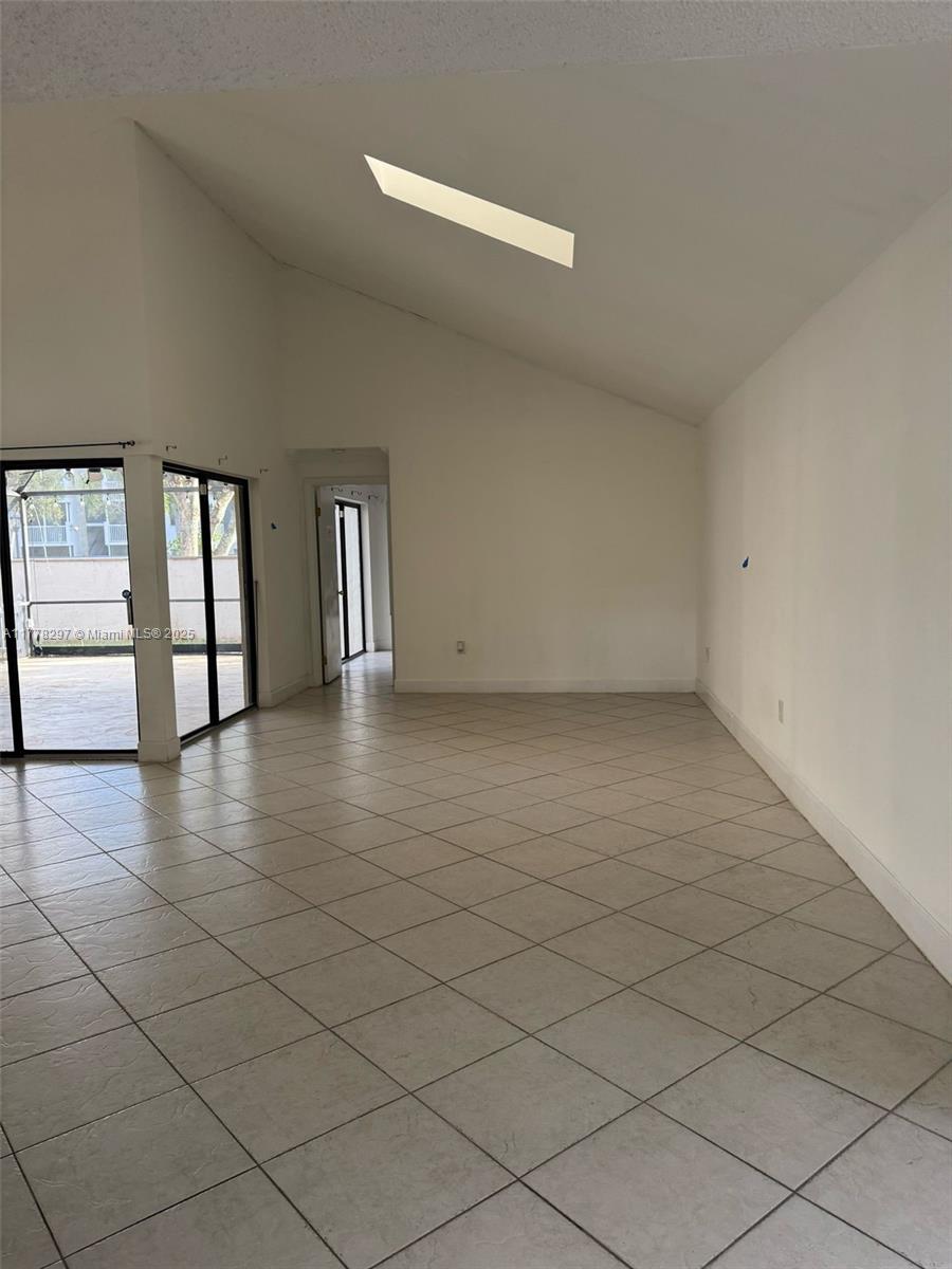 17320 Northwest 62nd Place Hialeah, FL 33015 - Photo 16 of 27 a view of an empty room with a window