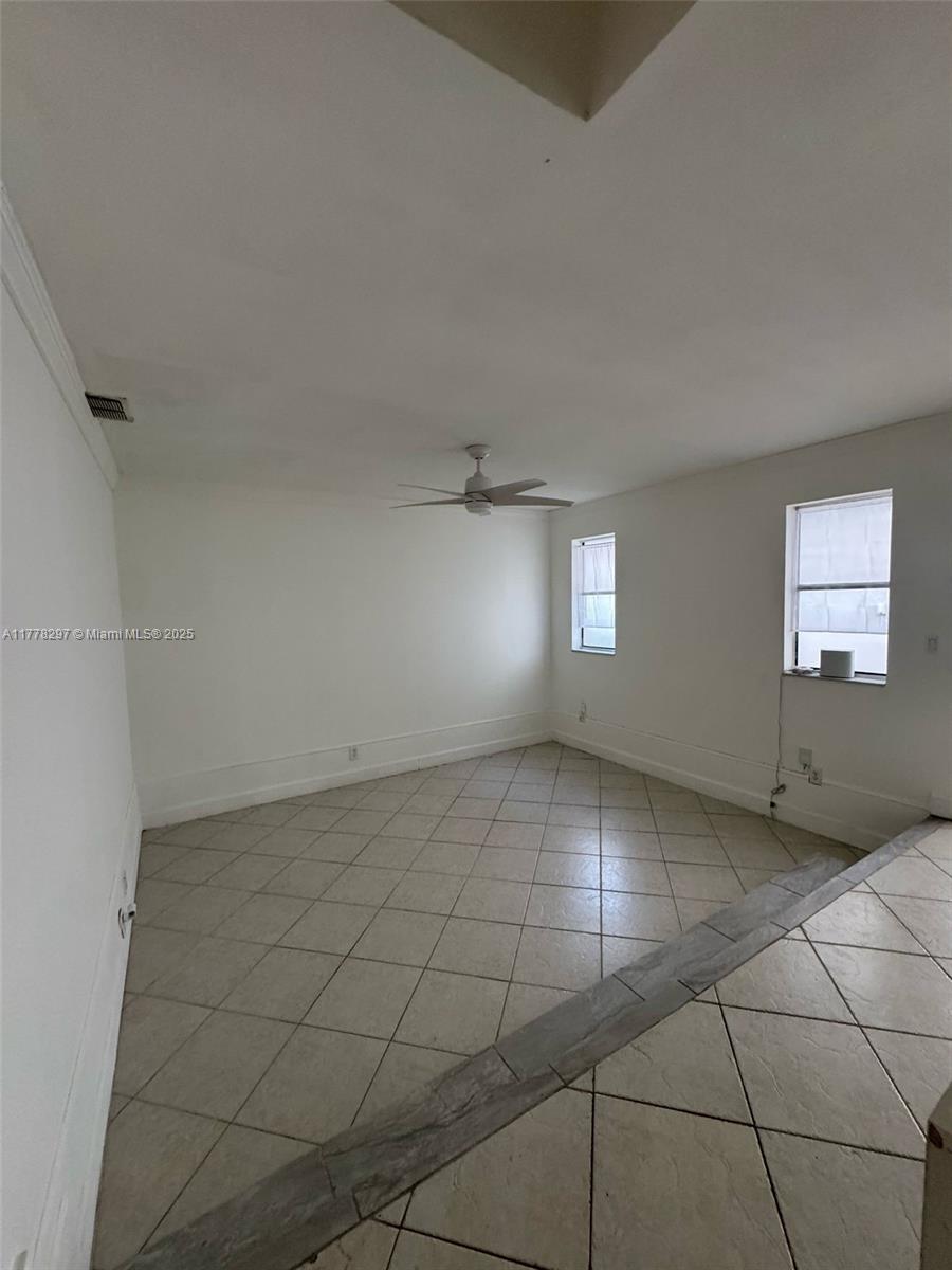 17320 Northwest 62nd Place Hialeah, FL 33015 - Photo 20 of 27 a view of an empty room and window
