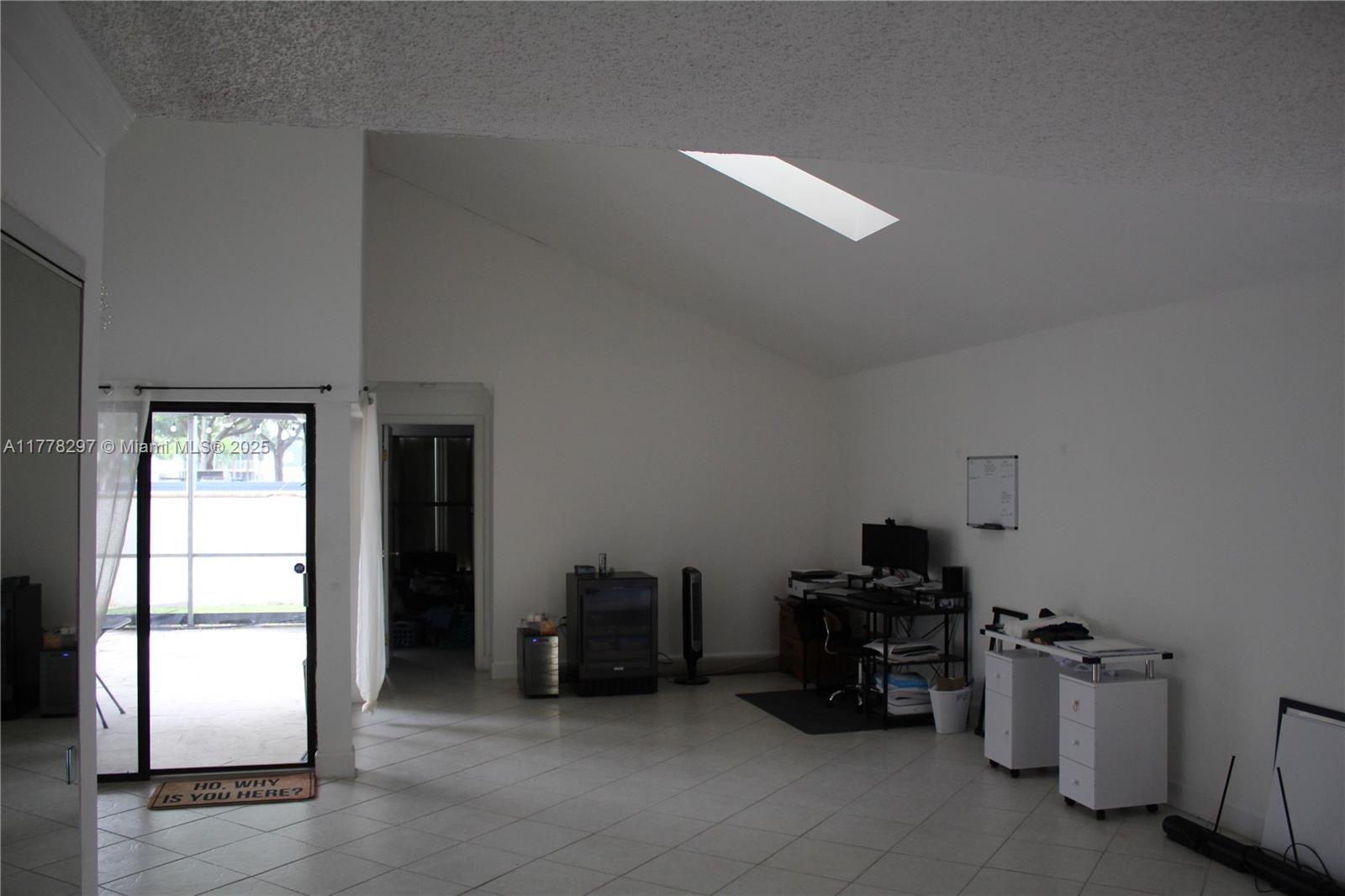 17320 Northwest 62nd Place Hialeah, FL 33015 - Photo 2 of 27 a room with furniture a air conditioner vent and a window
