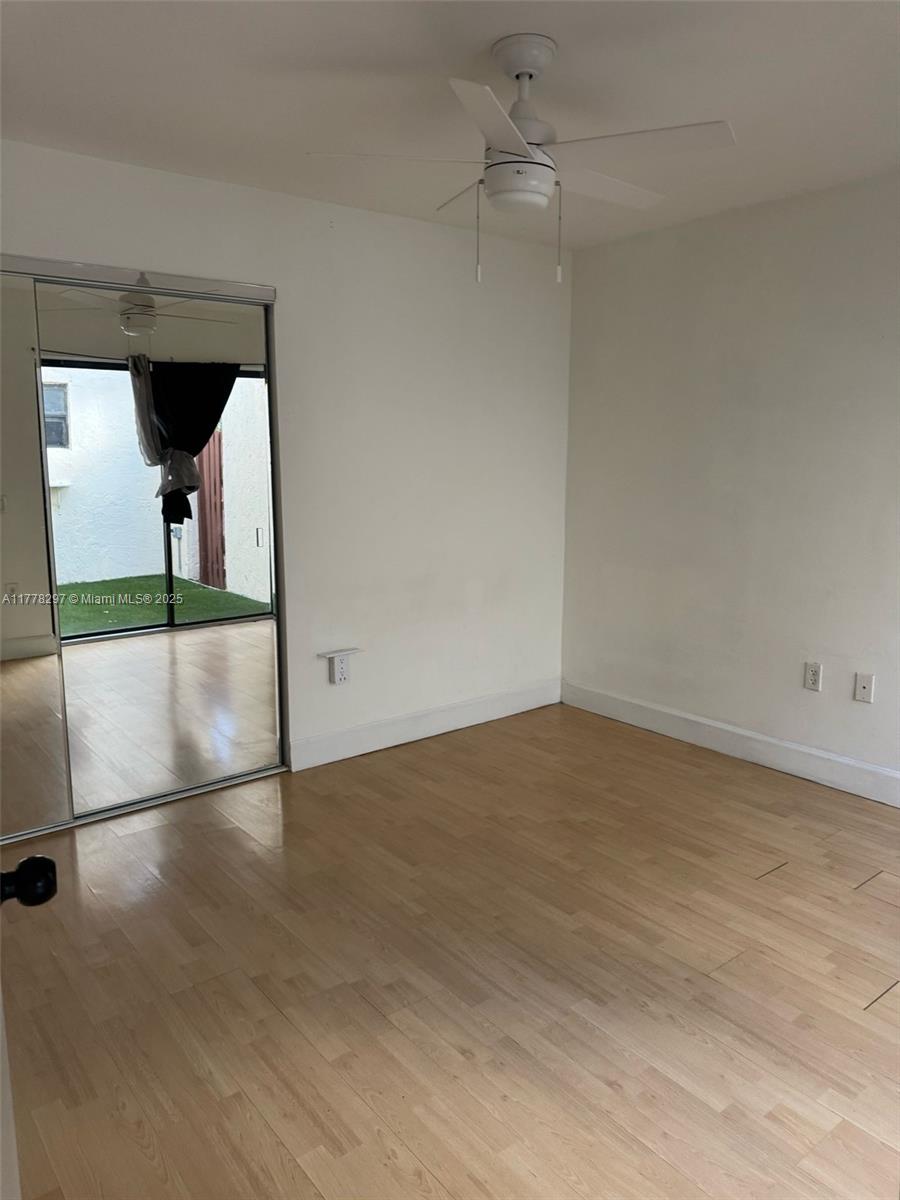 17320 Northwest 62nd Place Hialeah, FL 33015 - Photo 21 of 27 an empty room with wooden floor