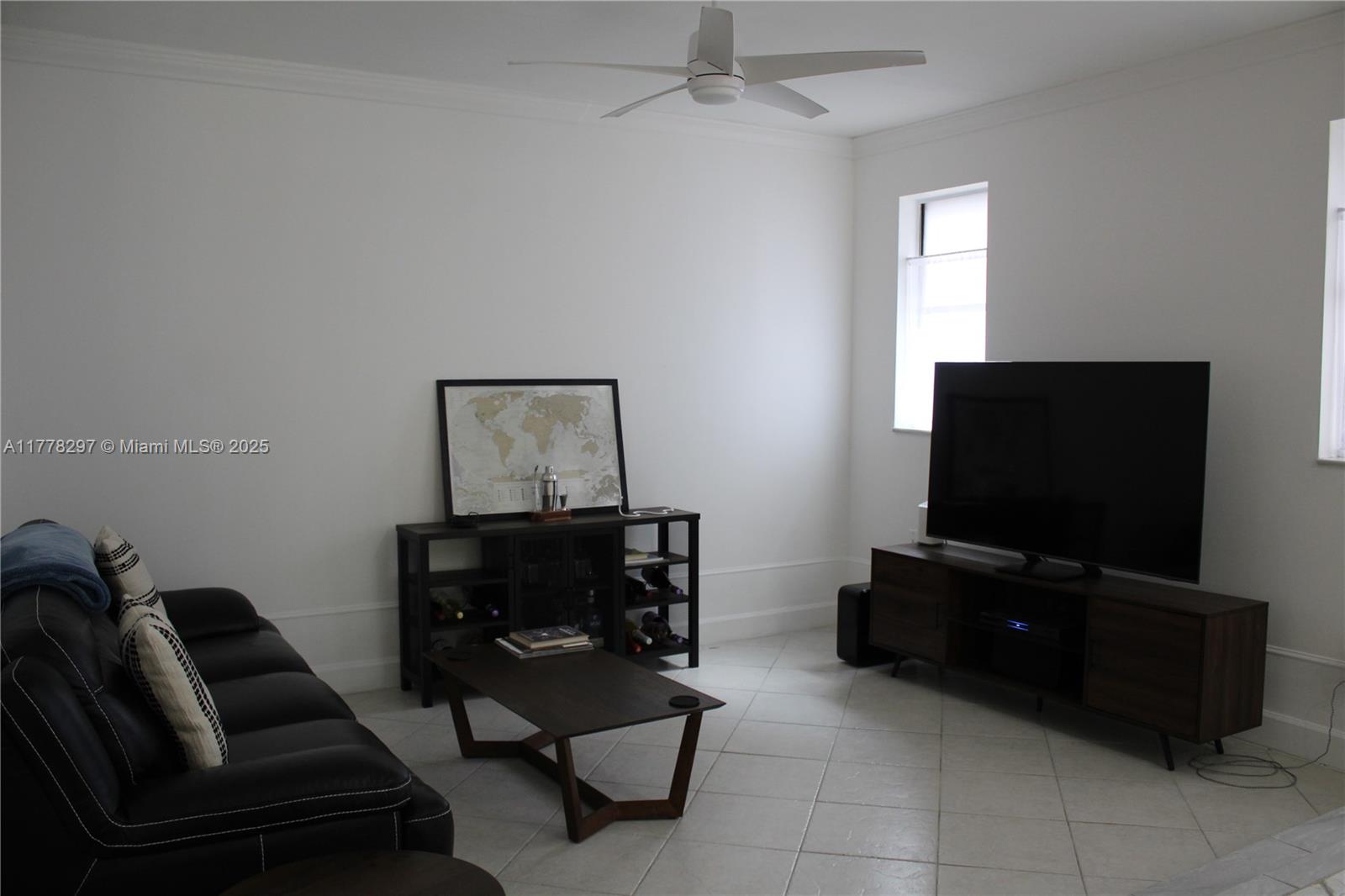 17320 Northwest 62nd Place Hialeah, FL 33015 - Photo 4 of 27 a living room with furniture and a flat screen tv