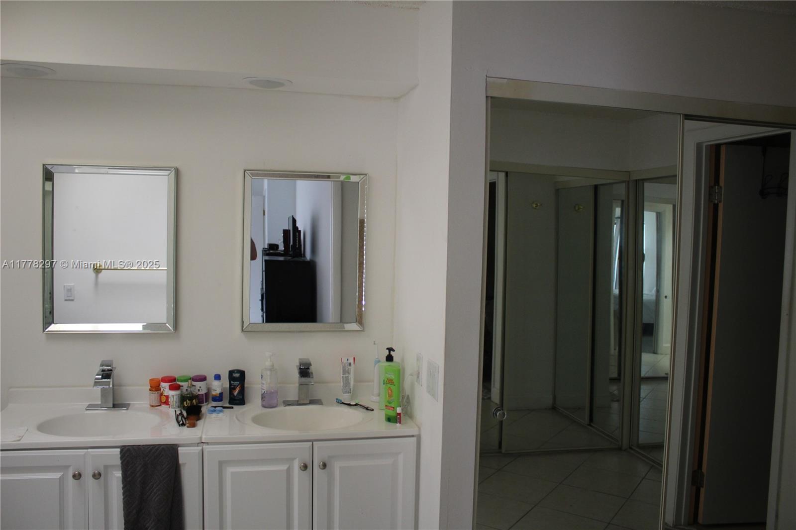 17320 Northwest 62nd Place Hialeah, FL 33015 - Photo 7 of 27 a bathroom with a sink and a mirror