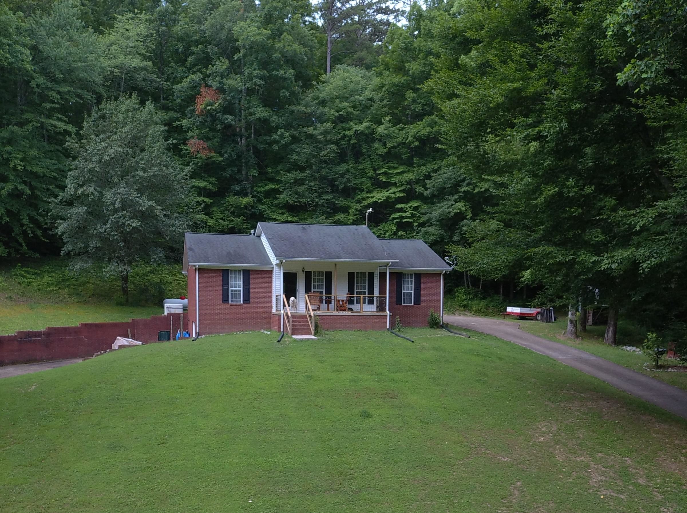 576 Carroll Hollow Road Waynesboro, TN 38485 - Photo 1 of 40 a view of a house with a backyard porch and sitting area