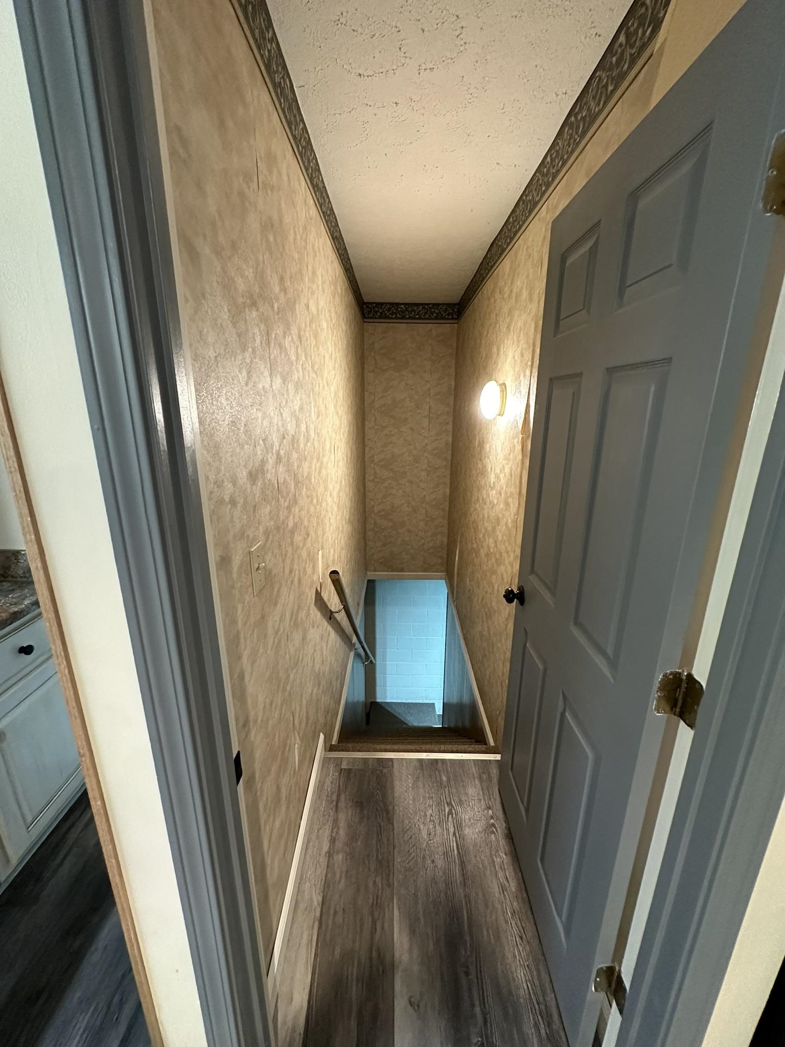 576 Carroll Hollow Road Waynesboro, TN 38485 - Photo 15 of 40 a view of a hallway with wooden floor and stairs
