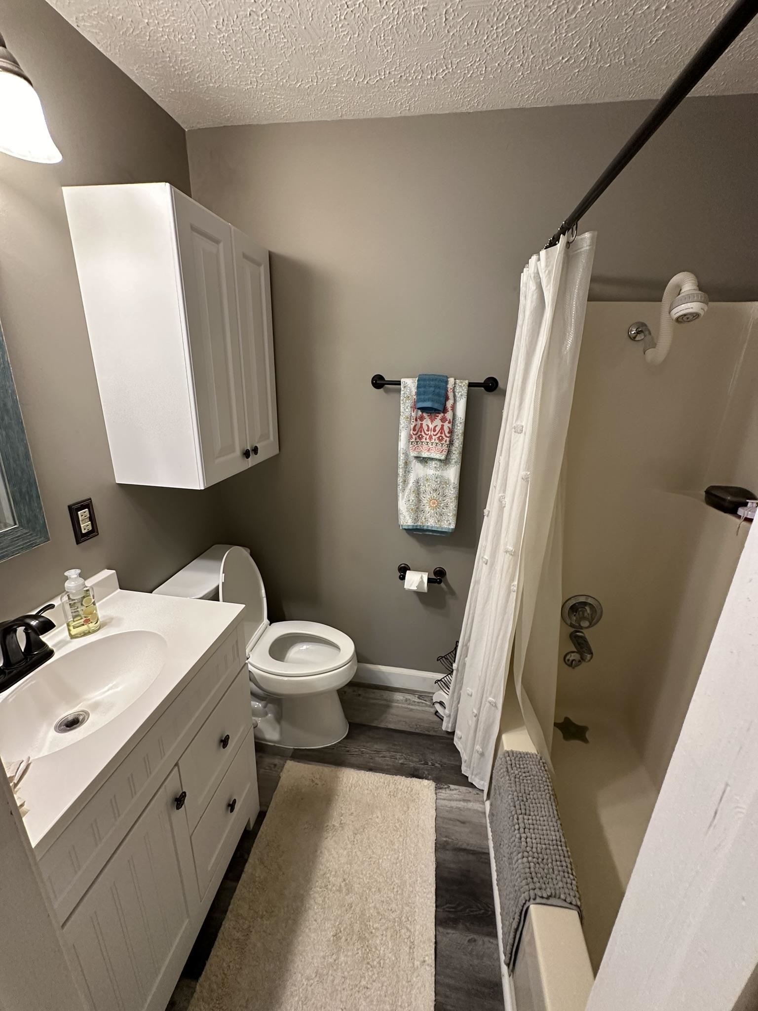 576 Carroll Hollow Road Waynesboro, TN 38485 - Photo 20 of 40 a bathroom with a sink toilet and tub
