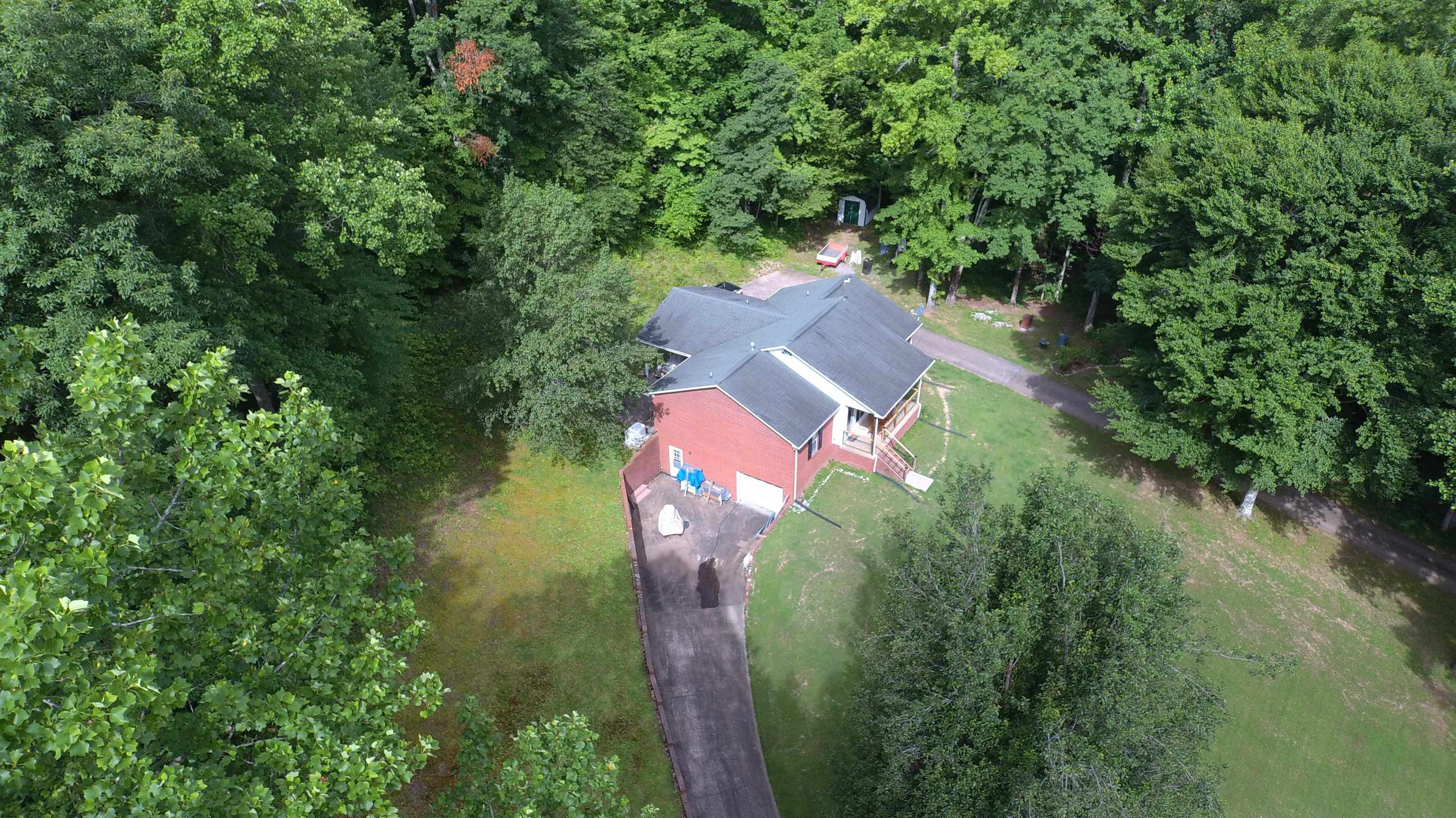 576 Carroll Hollow Road Waynesboro, TN 38485 - Photo 31 of 40 an aerial view of a house with outdoor space and trees all around