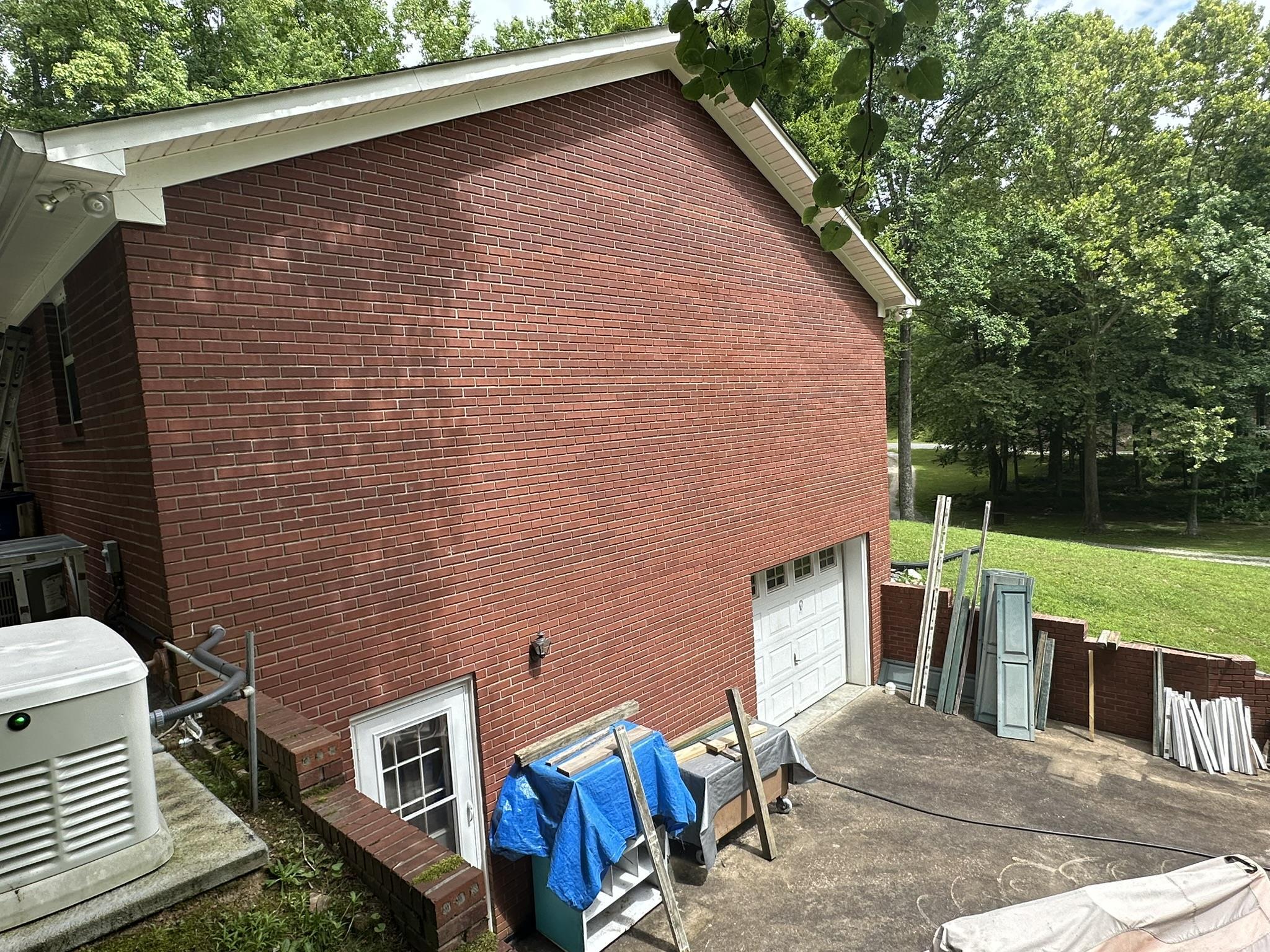 576 Carroll Hollow Road Waynesboro, TN 38485 - Photo 33 of 40 a brick building with a bench in front of it