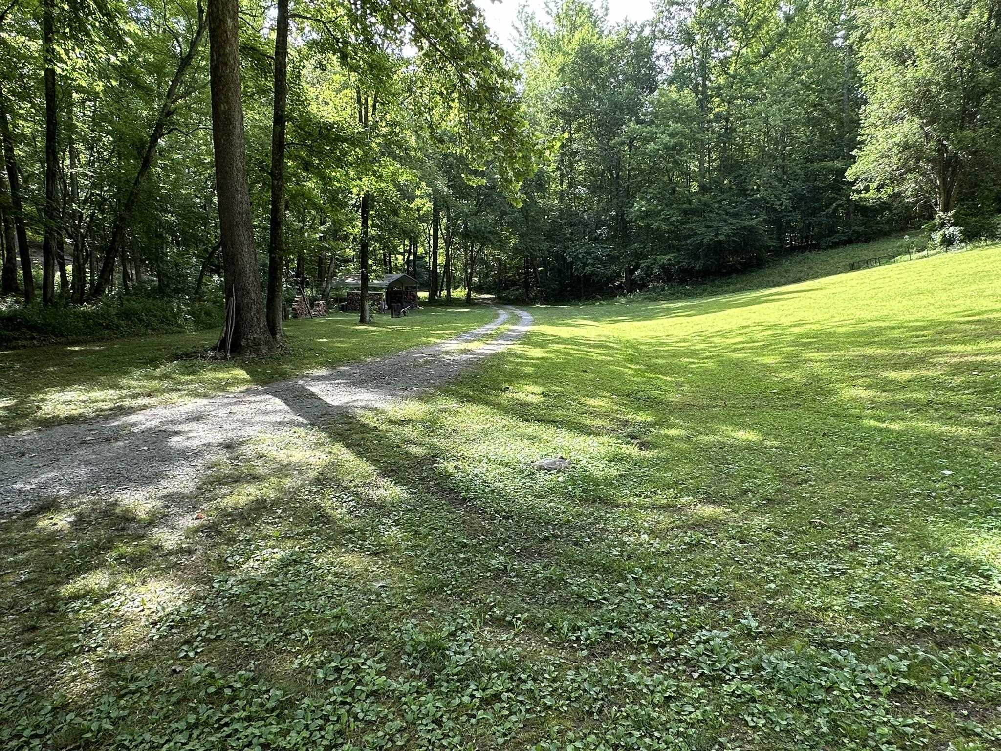 576 Carroll Hollow Road Waynesboro, TN 38485 - Photo 36 of 40 a view of outdoor space with a garden and trees