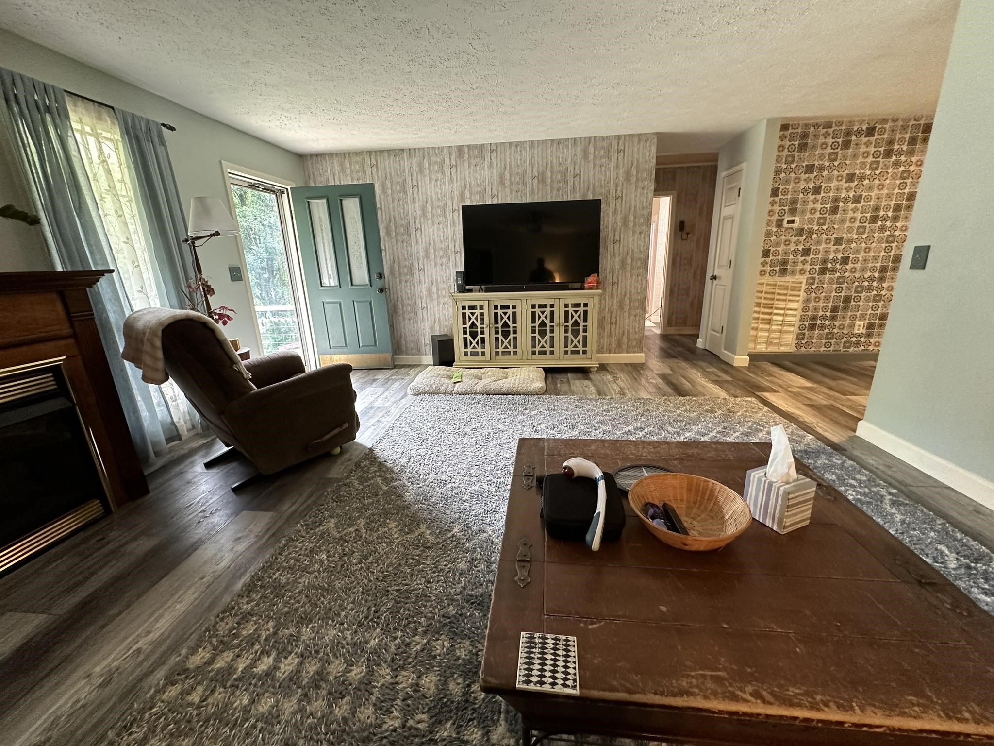576 Carroll Hollow Road Waynesboro, TN 38485 - Photo 6 of 40 a living room with furniture and a flat screen tv