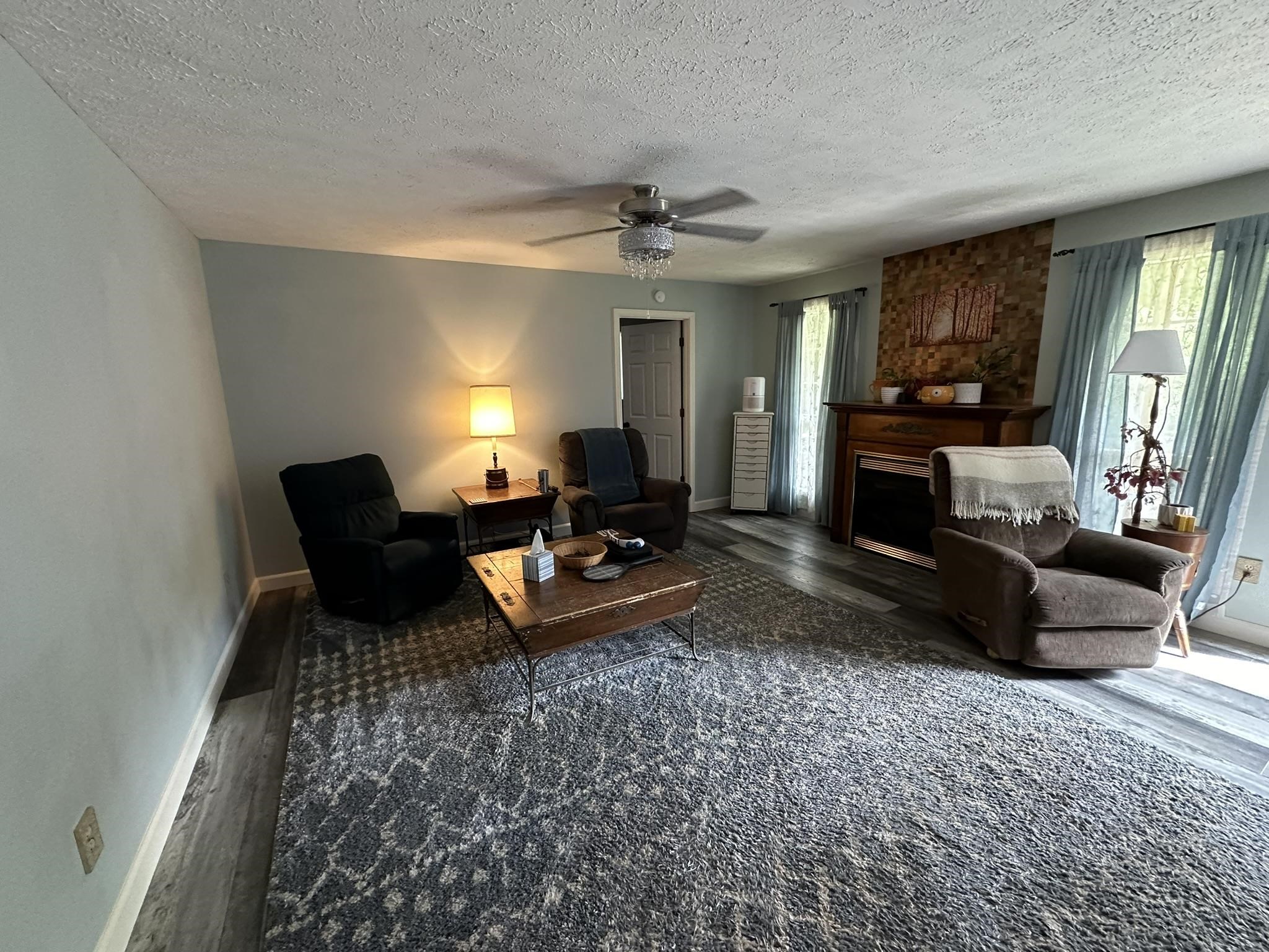 576 Carroll Hollow Road Waynesboro, TN 38485 - Photo 7 of 40 a living room with furniture and a fireplace
