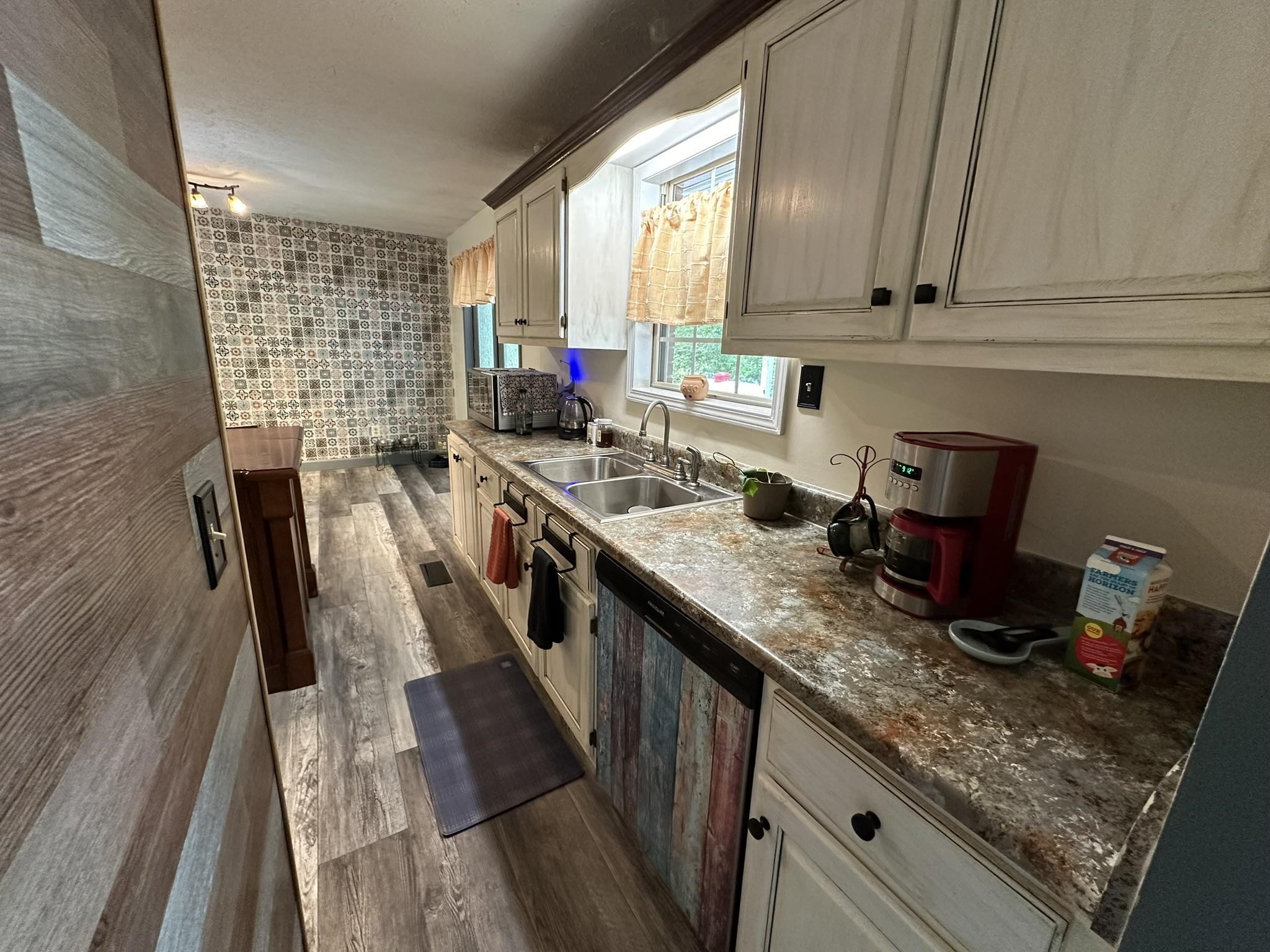 576 Carroll Hollow Road Waynesboro, TN 38485 - Photo 10 of 40 a kitchen with stainless steel appliances granite countertop sink stove top oven and cabinets