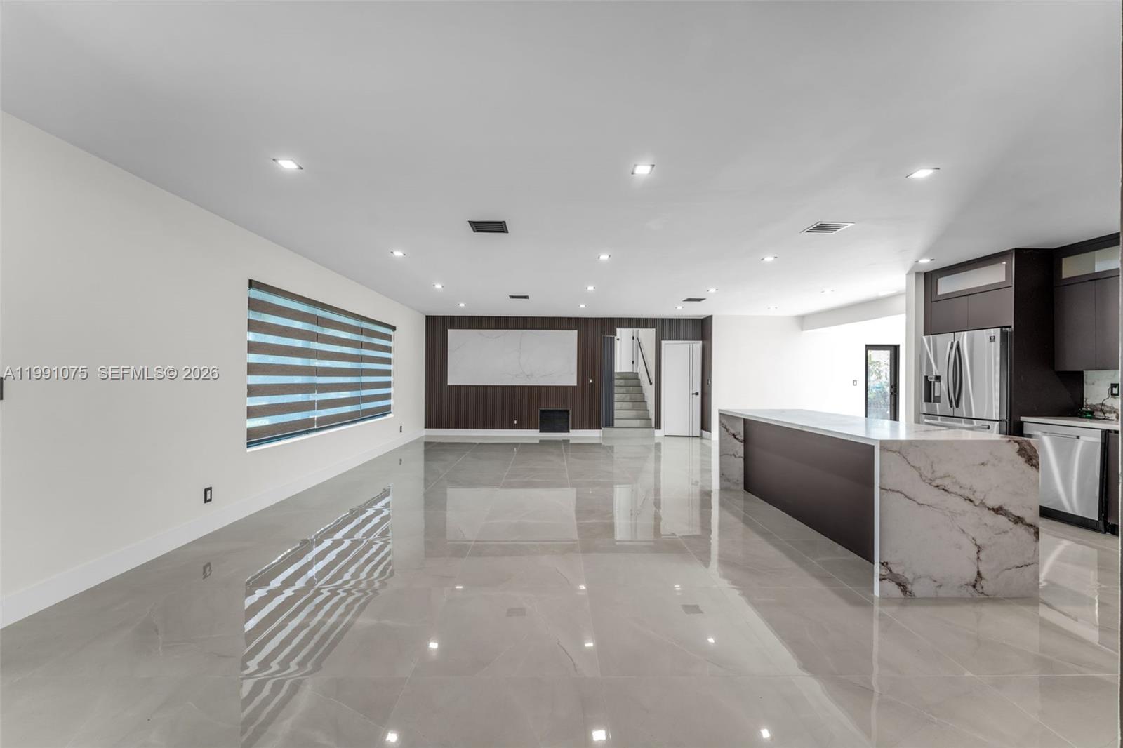 7920 Southwest 132nd Street Pinecrest, FL 33156 - Photo 21 of 45 a large white kitchen with a large window