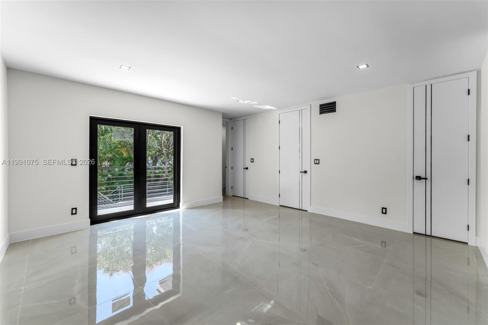 7920 Southwest 132nd Street Pinecrest, FL 33156 - Photo 24 of 45 a view of an empty room with a window