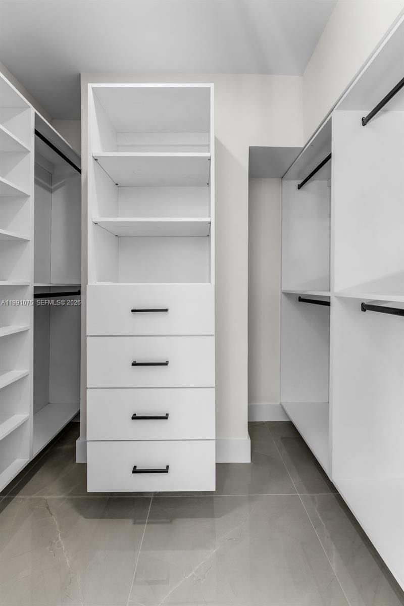7920 Southwest 132nd Street Pinecrest, FL 33156 - Photo 28 of 45 a view of an empty walk in closet