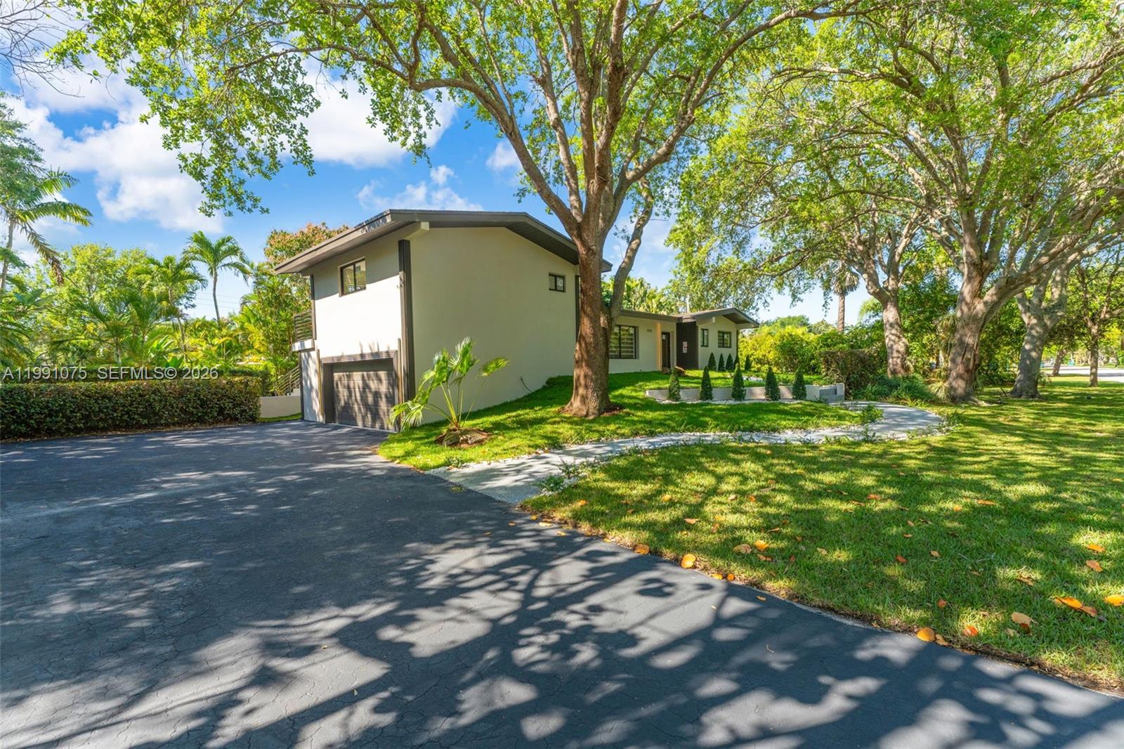 7920 Southwest 132nd Street Pinecrest, FL 33156 - Photo 3 of 45 a view of a park with large trees