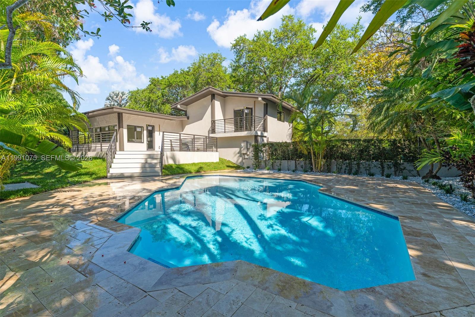 7920 Southwest 132nd Street Pinecrest, FL 33156 - Photo 33 of 45 a view of backyard with a garden and plants