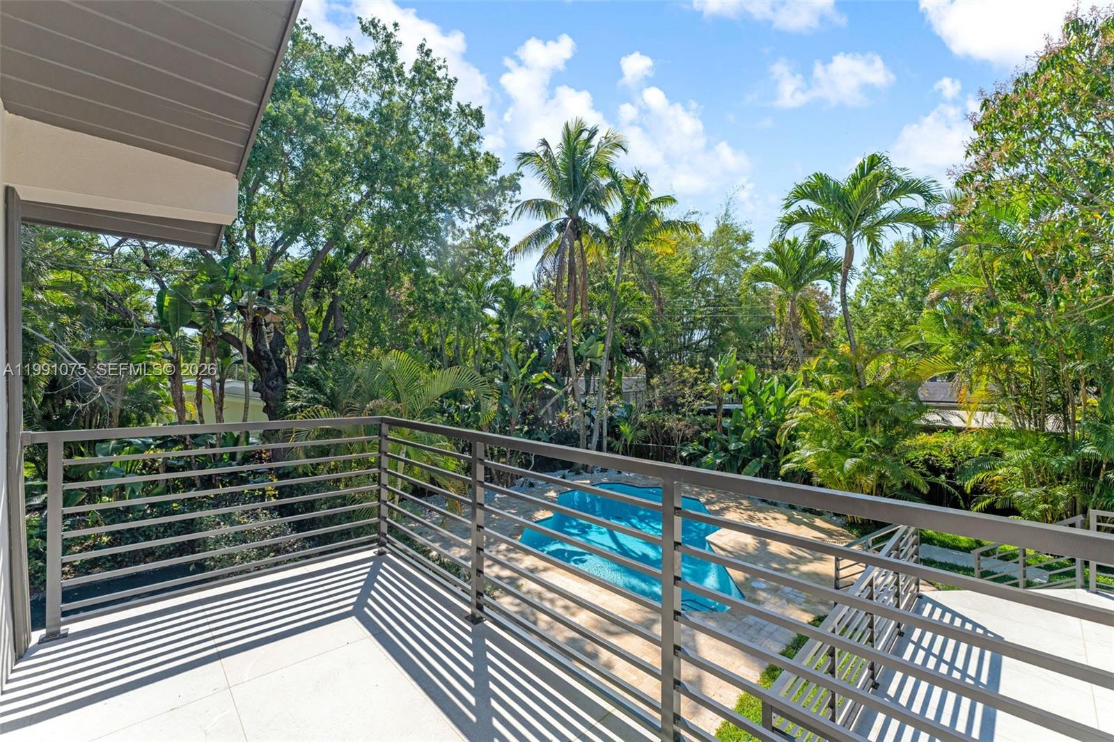 7920 Southwest 132nd Street Pinecrest, FL 33156 - Photo 37 of 45 a view of balcony and yard