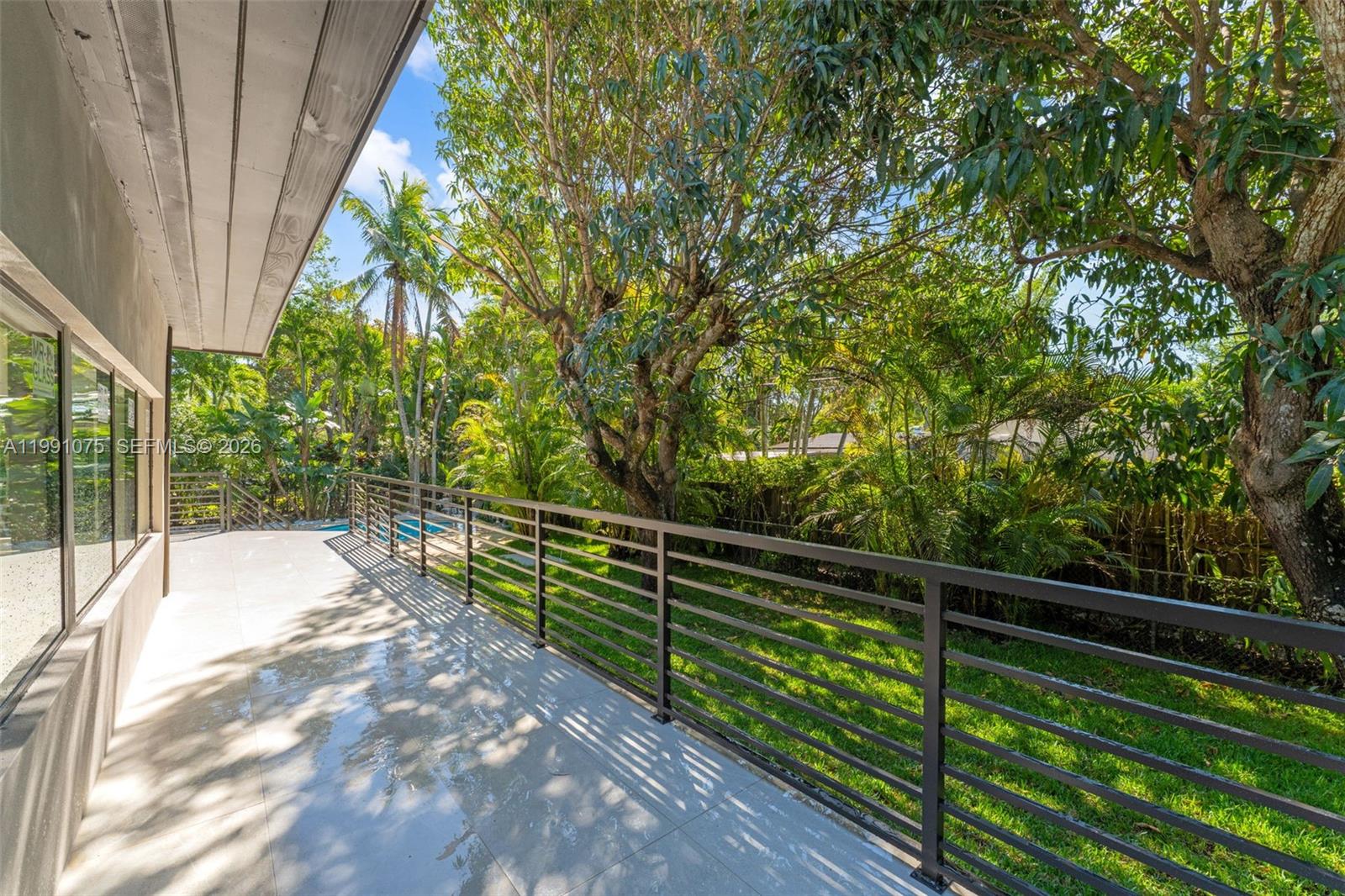 7920 Southwest 132nd Street Pinecrest, FL 33156 - Photo 40 of 45 a view of balcony with yard