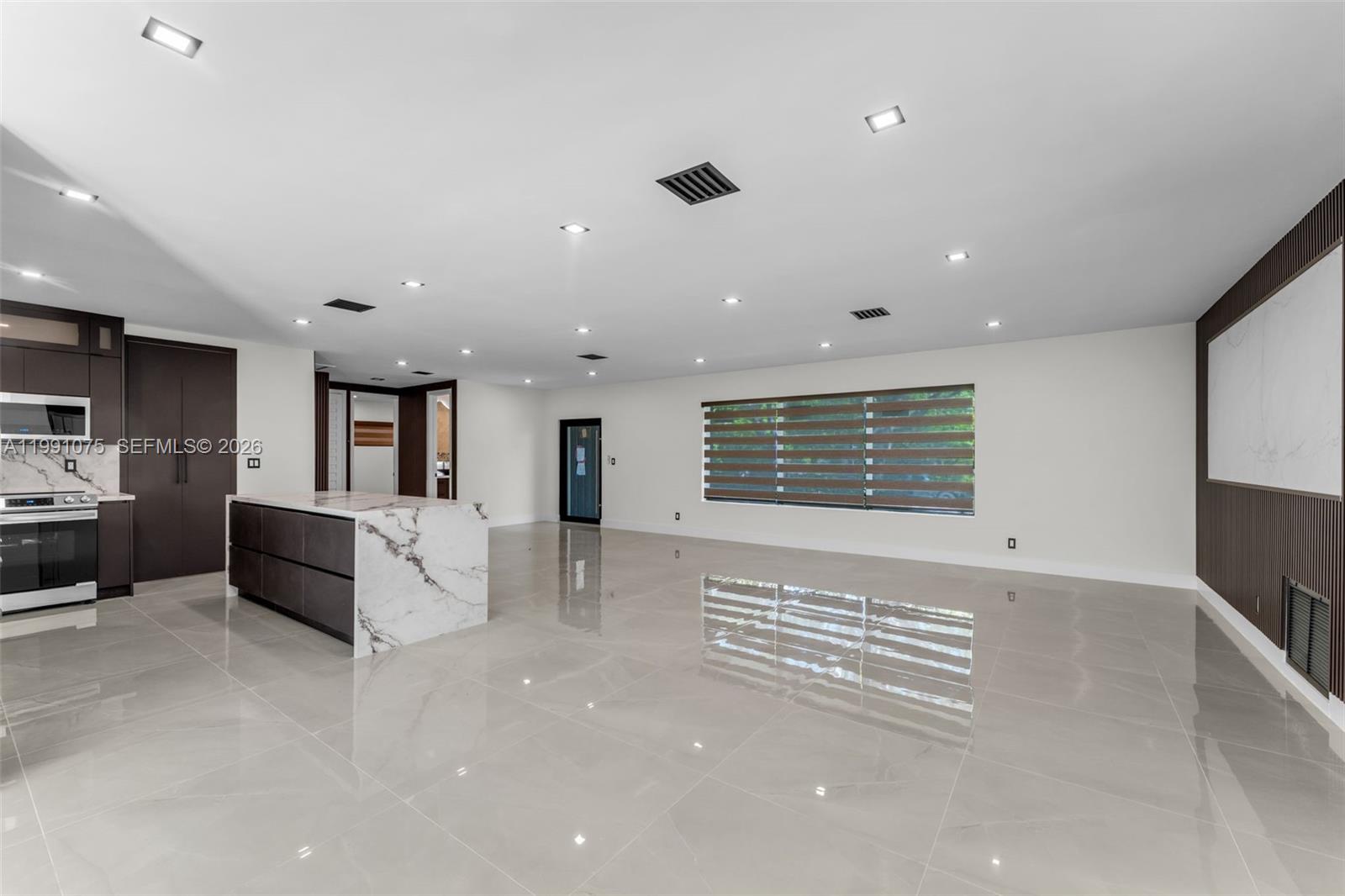 7920 Southwest 132nd Street Pinecrest, FL 33156 - Photo 7 of 45 a living room with furniture and a large window