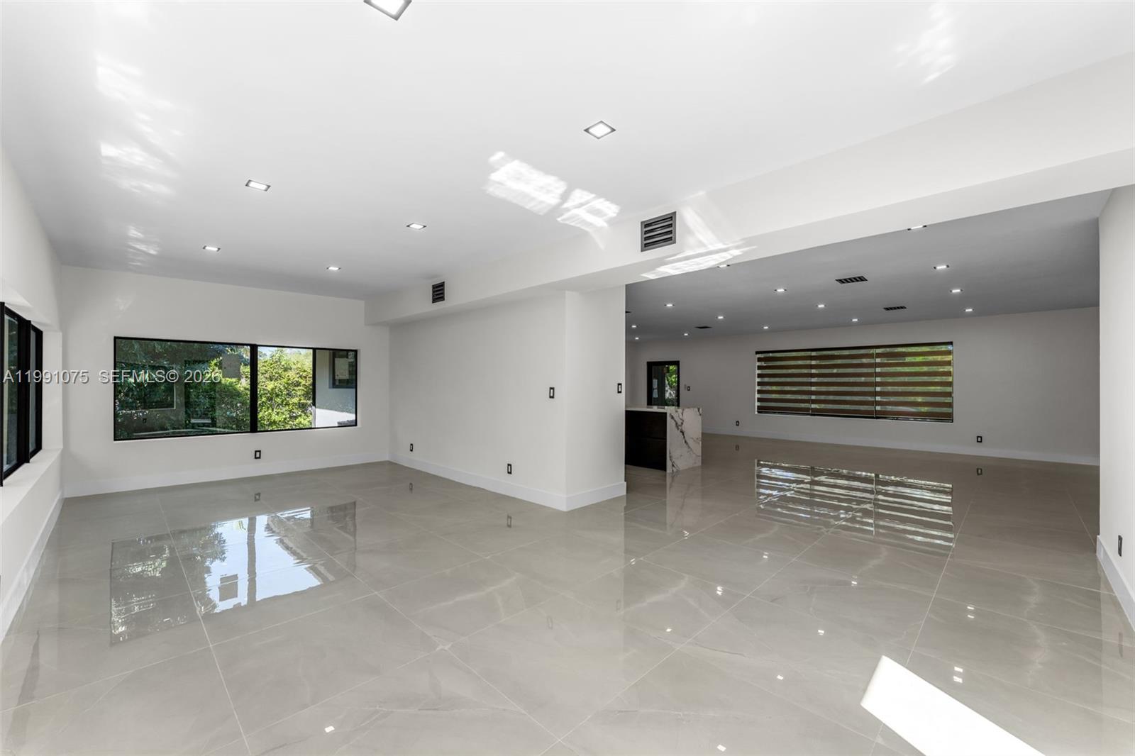 7920 Southwest 132nd Street Pinecrest, FL 33156 - Photo 9 of 45 a view of an empty room with a window