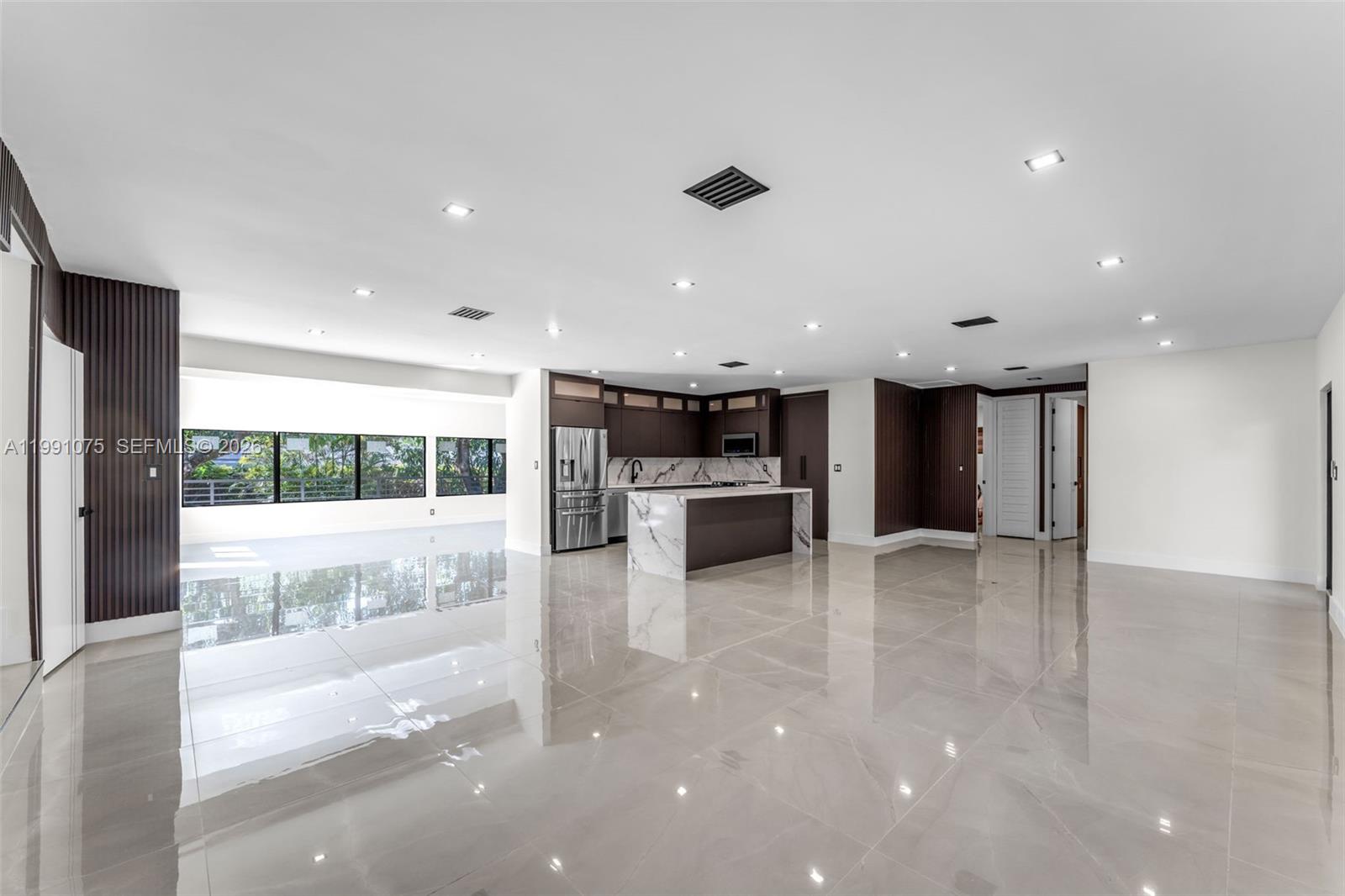 7920 Southwest 132nd Street Pinecrest, FL 33156 - Photo 10 of 45 a view of kitchen with kitchen island and living room