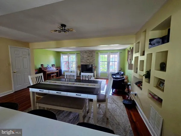 a view of living room with furniture and a fireplace