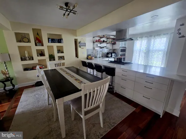 a kitchen with granite countertop lots of counter top space and furniture
