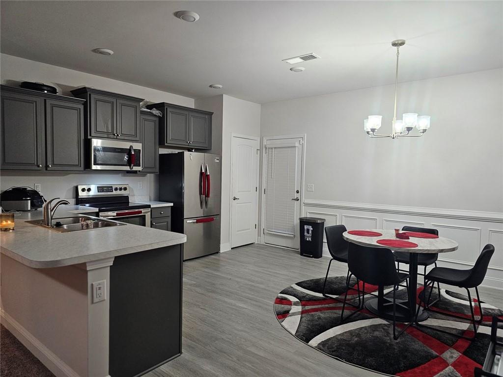 2153 Red Oak Circle Union City, GA 30291 - Photo 19 of 34 a kitchen with kitchen island a sink stove and refrigerator