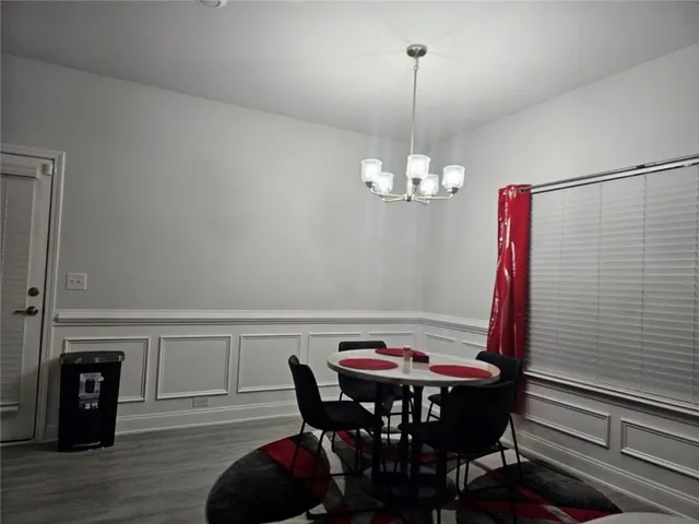 a kitchen with stainless steel appliances a refrigerator stove and microwave