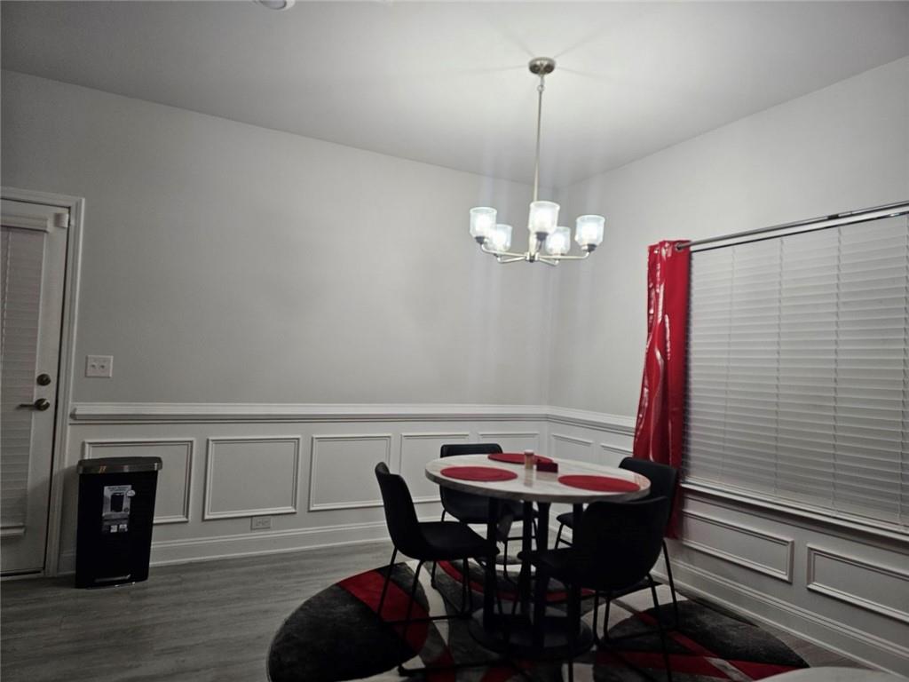 2153 Red Oak Circle Union City, GA 30291 - Photo 20 of 34 a view of a dining room with furniture and wooden floor