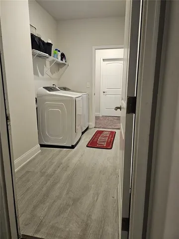 a bed room with a bed and a chandelier