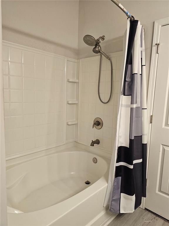 2153 Red Oak Circle Union City, GA 30291 - Photo 31 of 34 a bathroom with a bath tub with a glass door shower