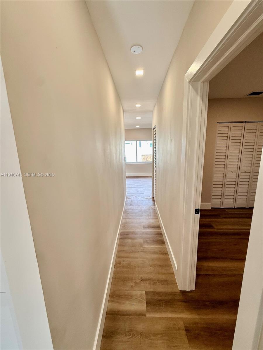 14600 Harrison Street Miami, FL 33176 - Photo 11 of 32 a view of a hallway with wooden floor and staircase
