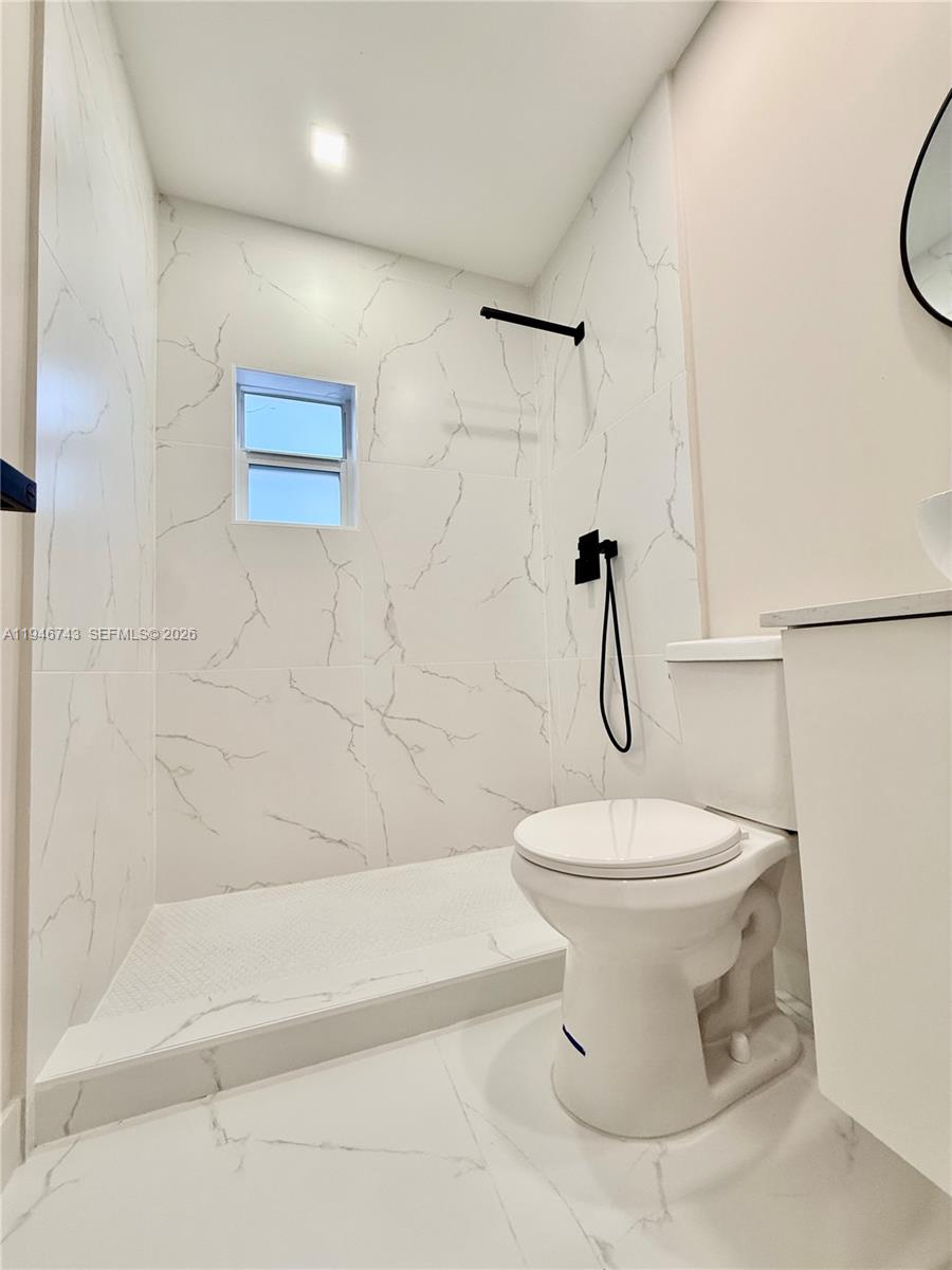 14600 Harrison Street Miami, FL 33176 - Photo 14 of 32 a bathroom with a toilet and a shower