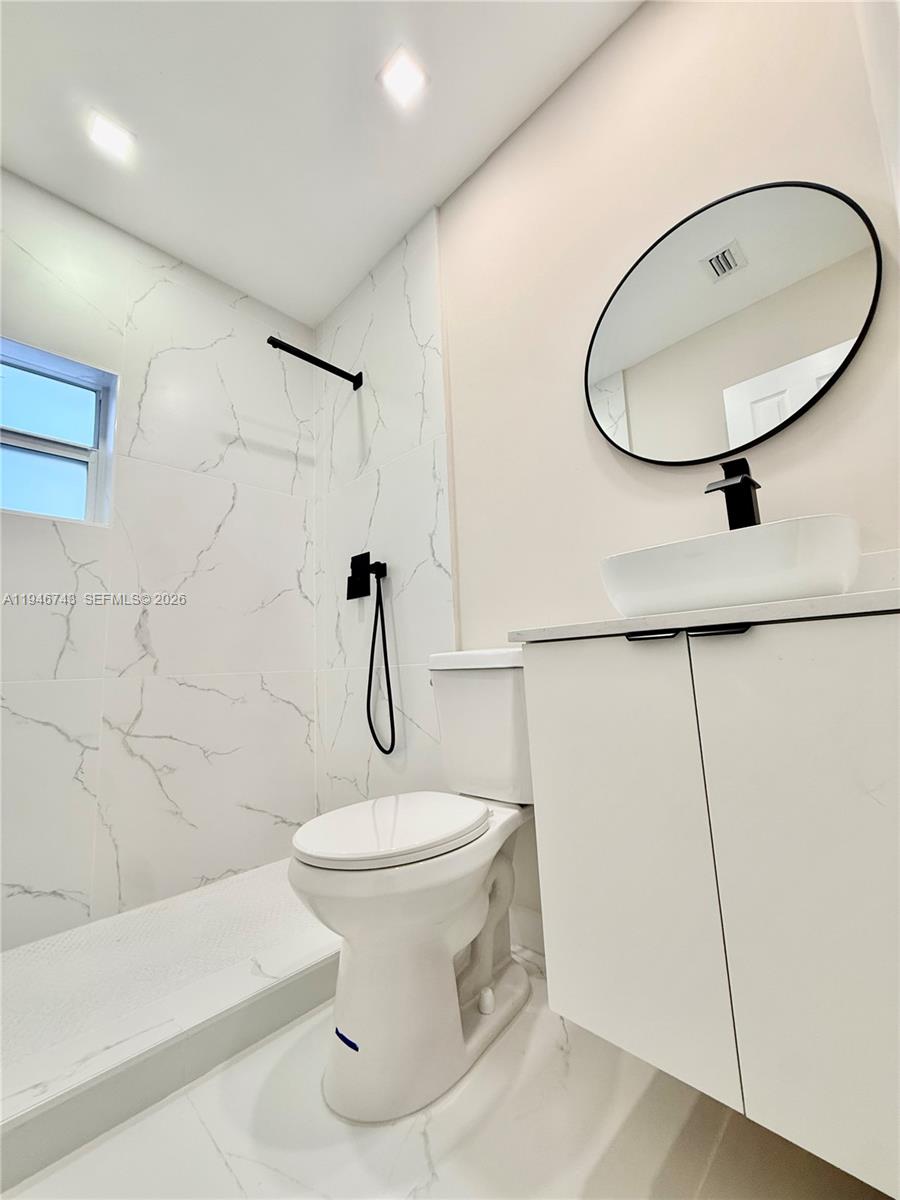 14600 Harrison Street Miami, FL 33176 - Photo 19 of 32 a bathroom with a sink toilet and shower