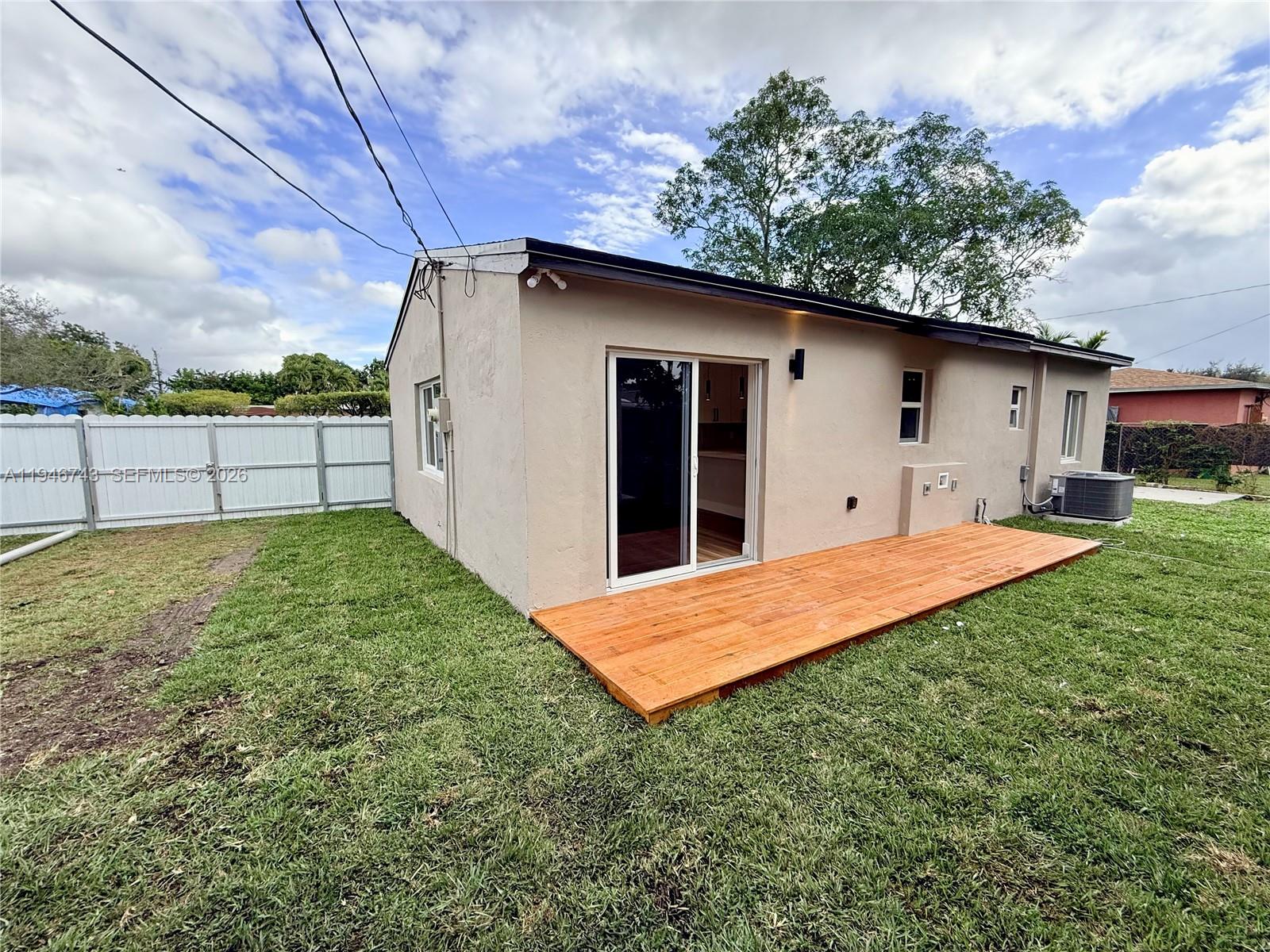 14600 Harrison Street Miami, FL 33176 - Photo 2 of 32 a backyard of a house with table and chairs
