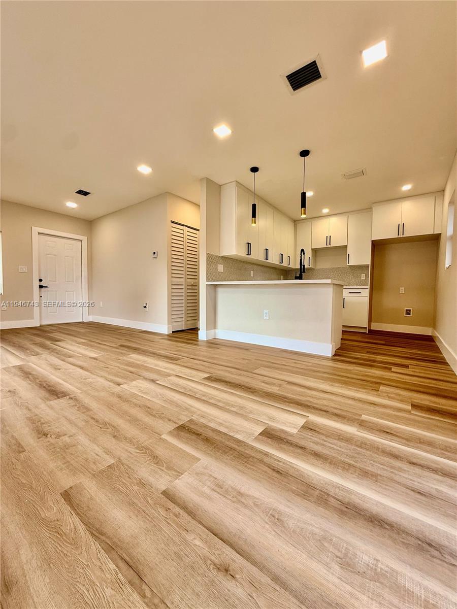 14600 Harrison Street Miami, FL 33176 - Photo 26 of 32 a view of a kitchen with kitchen island a sink stainless steel appliances and cabinets