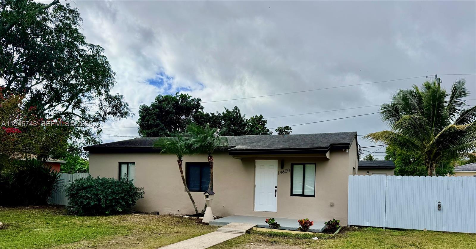 14600 Harrison Street Miami, FL 33176 - Photo 30 of 32 a front view of a house with garden