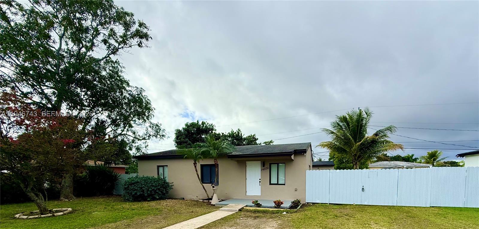 14600 Harrison Street Miami, FL 33176 - Photo 31 of 32 a front view of a house with garden