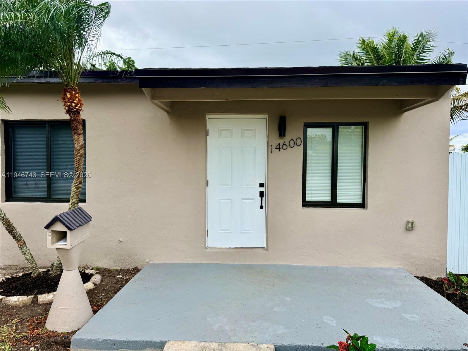 14600 Harrison Street Miami, FL 33176 - Photo 32 of 32 a front view of a house with a yard