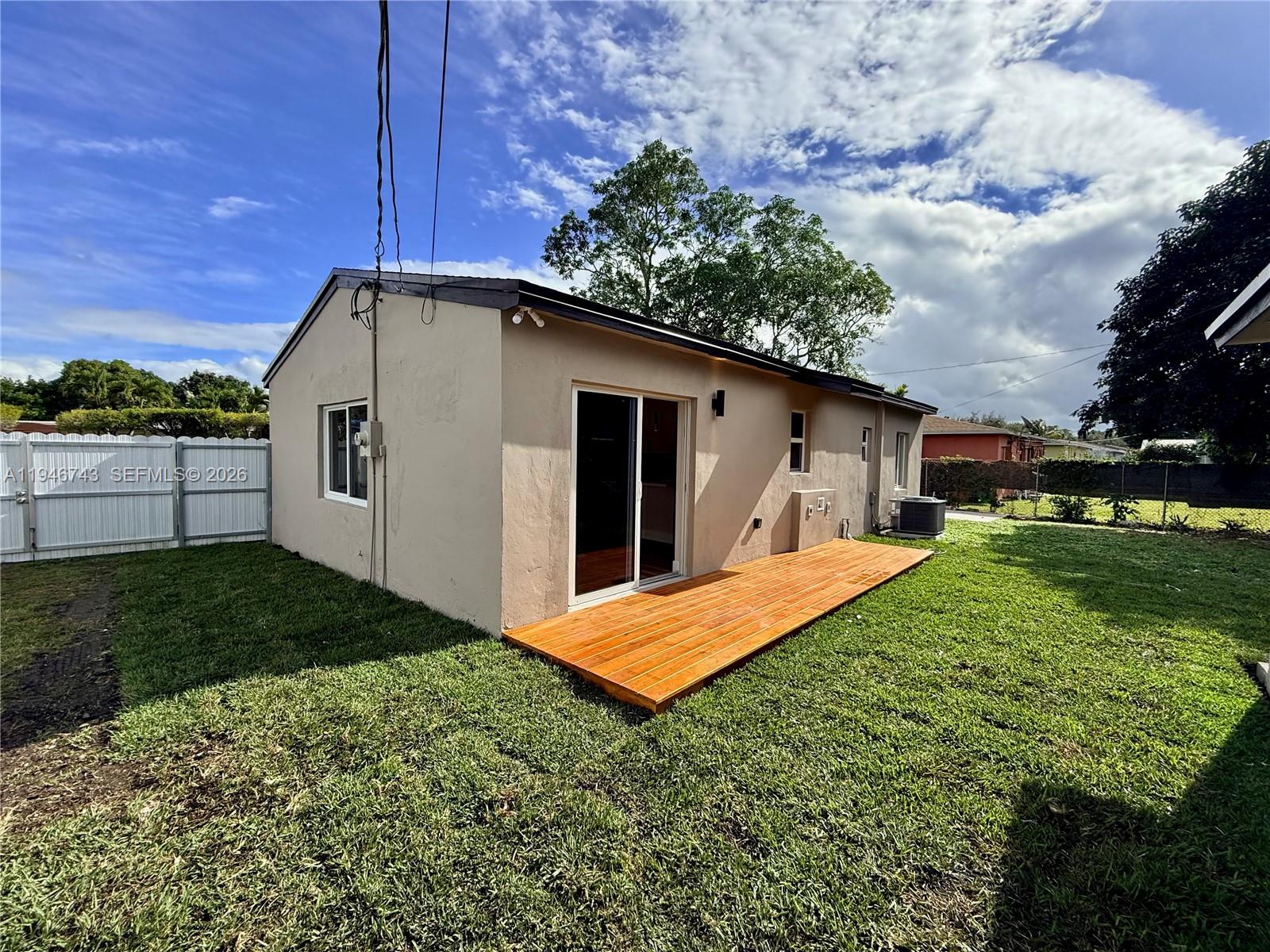 14600 Harrison Street Miami, FL 33176 - Photo 4 of 32 a backyard of a house with table and chairs