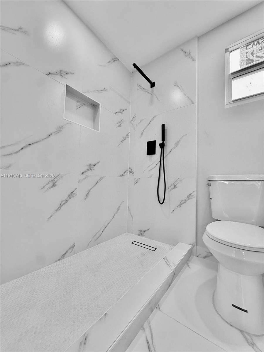 14600 Harrison Street Miami, FL 33176 - Photo 9 of 32 a bathroom with a granite countertop sink a toilet and shower