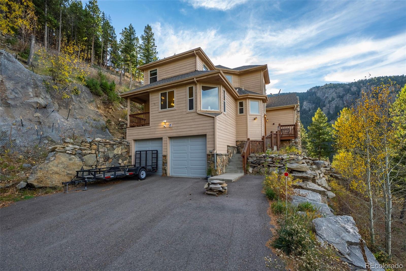 900 Sawmill Creek Road Evergreen, CO 80439 - Photo 14 of 50 a view of a car park in front of house