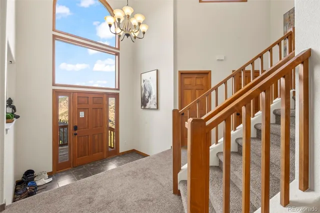 a view of an entryway with wooden floor