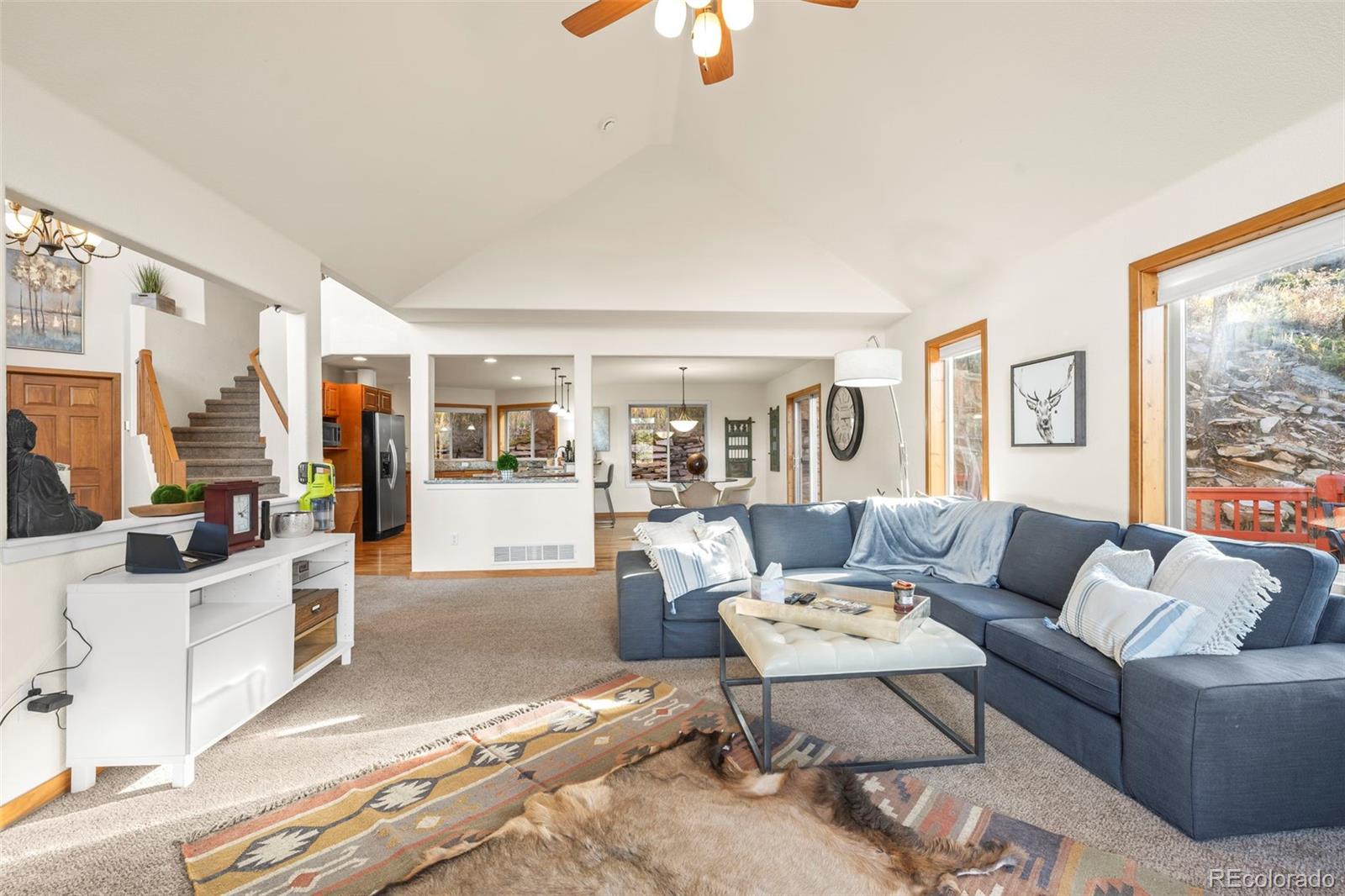 900 Sawmill Creek Road Evergreen, CO 80439 - Photo 20 of 50 a living room with furniture and a large window