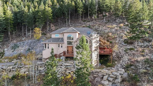 a aerial view of a house with a yard